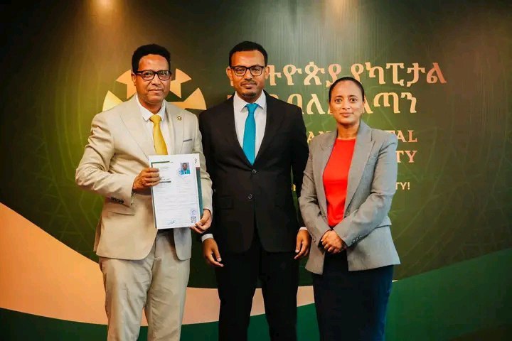 Ethio Fidelity representatives receiving the securities dealer licence certificate at the Ethiopian Capital Market Authority