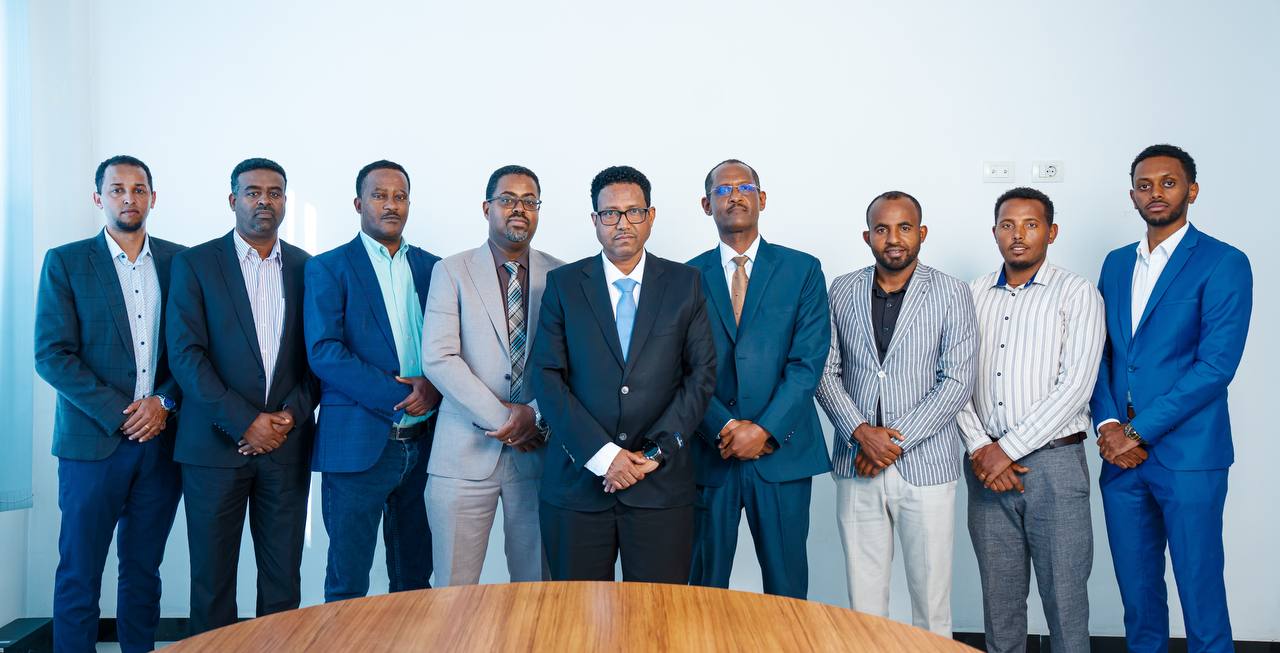 The Ethio Fidelity team standing together in the firm's boardroom
